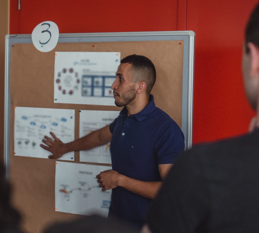 Taz teaching at whiteboard